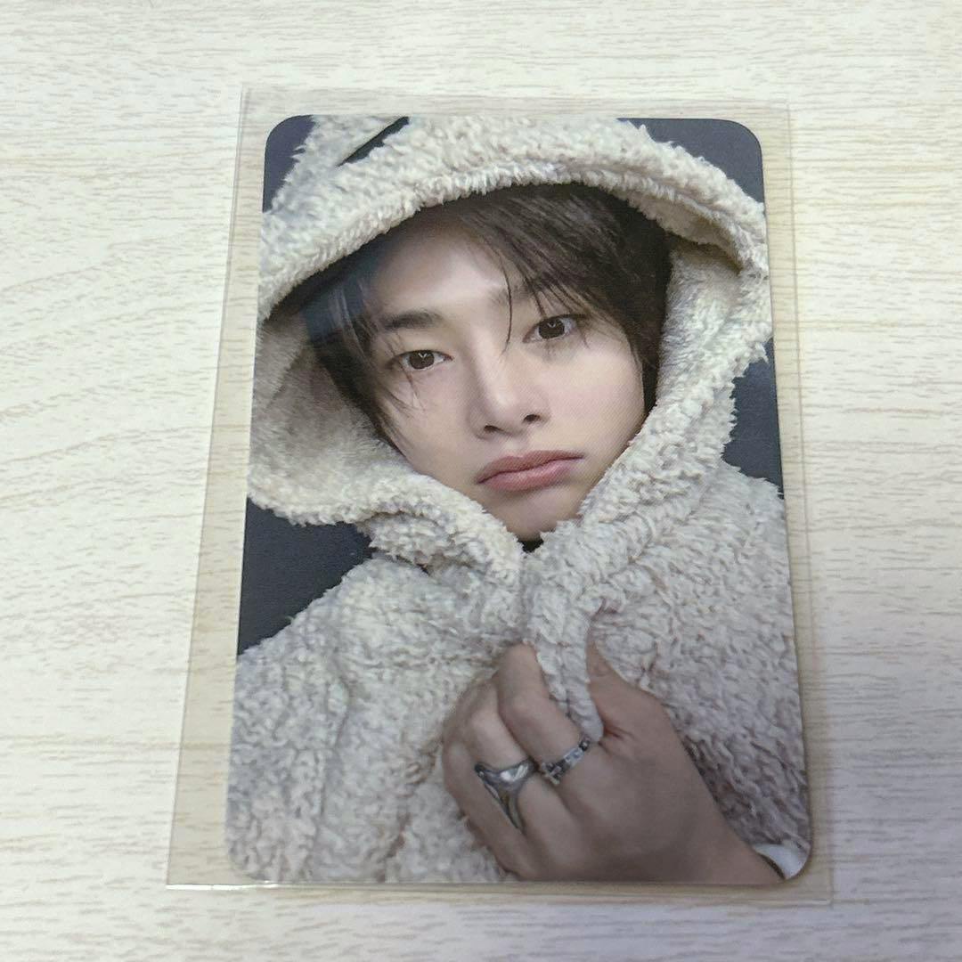 Front of a Stray Kids KARMA photocard showing a person wearing a fuzzy hooded garment.
