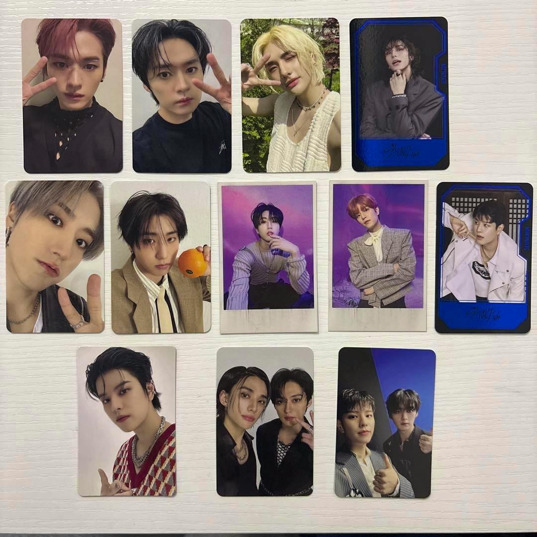 Bulk set of photocards laid out in rows on a light surface showing multiple portrait-style cards.