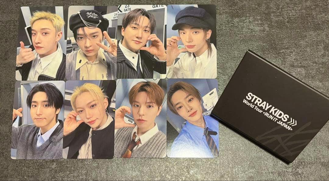 Stray Kids RUN IT photocard set laid out in two rows with a black Stray Kids box at right.