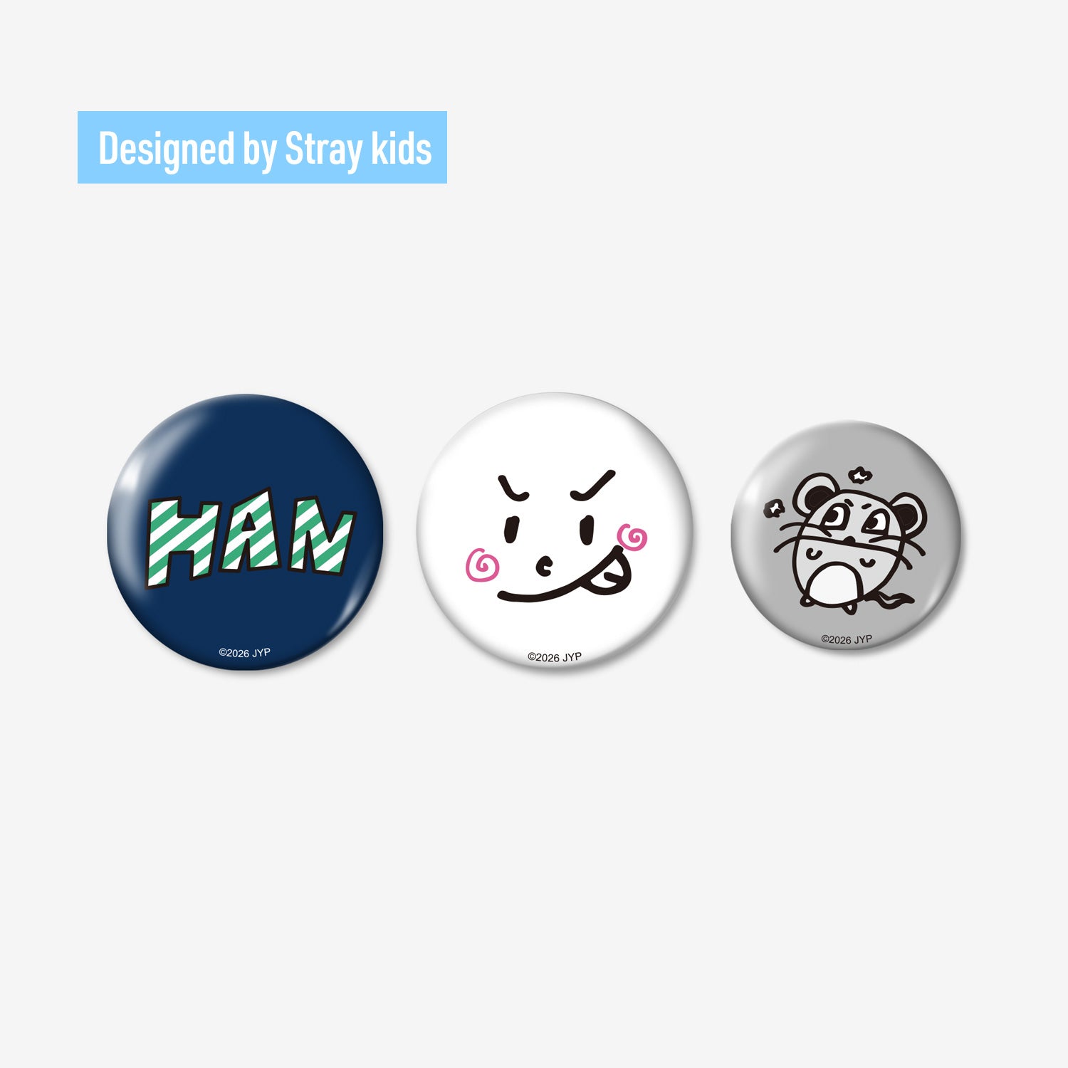 Three round badges from the BADGE SET (3PIECES) - HAN / Stray Kids «World Tour <RUN IT JAPAN>», showing a blue 'HAN' badge, a white doodle face badge, and a gray tiger-sketch badge on a white background.