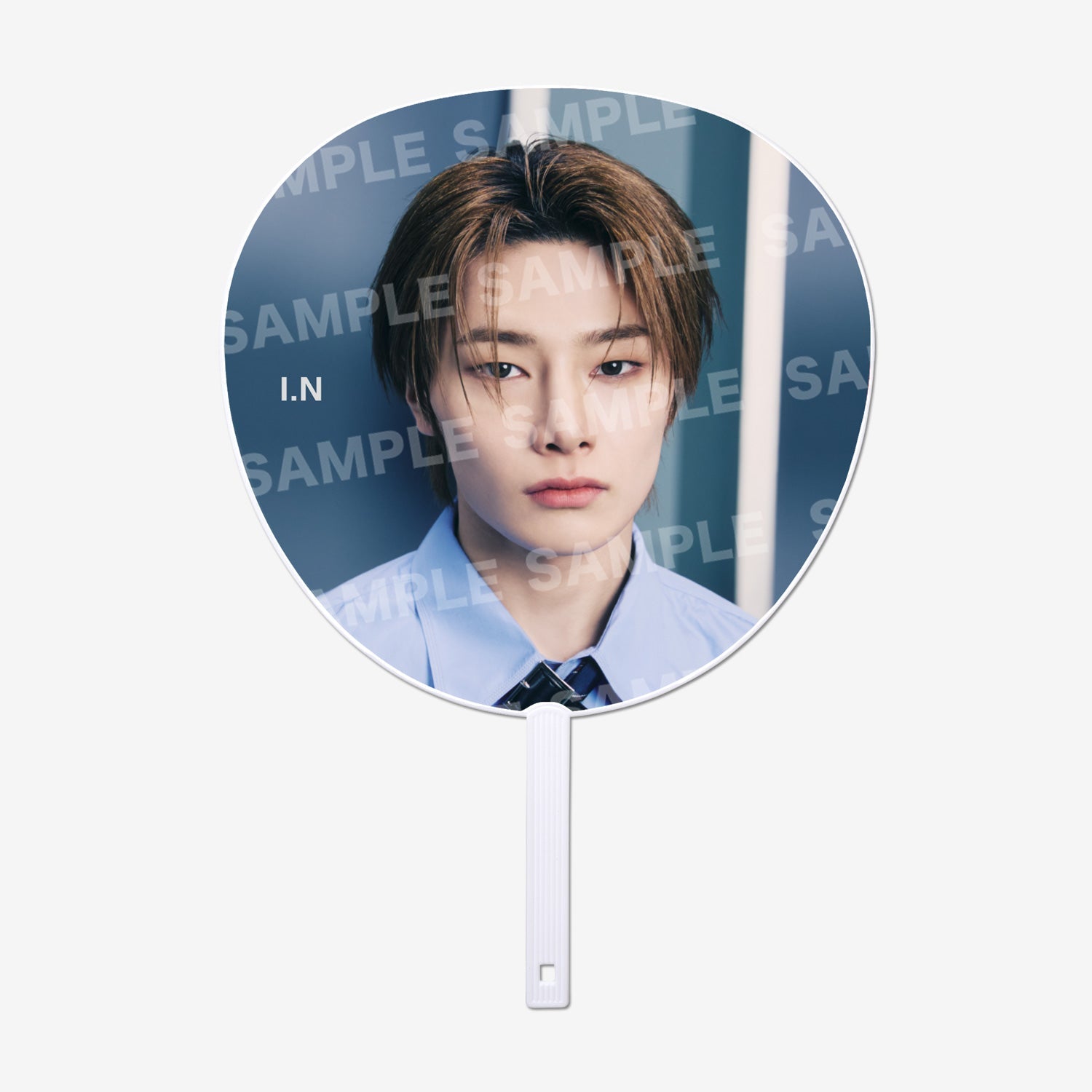 Round paper hand fan showing a close-up portrait of a young man wearing a blue shirt and tie, with a white handle.