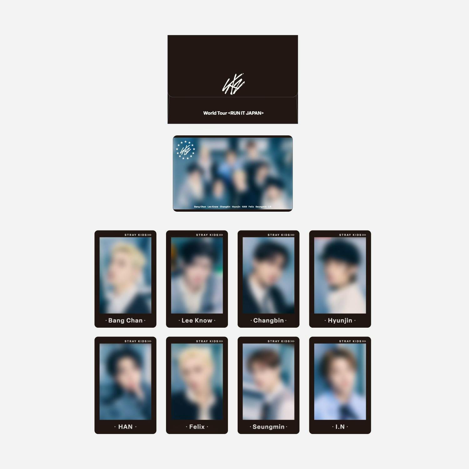 Layout photo of nine Stray Kids photocards with member names and a World Tour <RUN IT JAPAN> themed envelope.