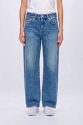 Front view of women's blue vintage-style jeans worn by a model standing against a plain background.
