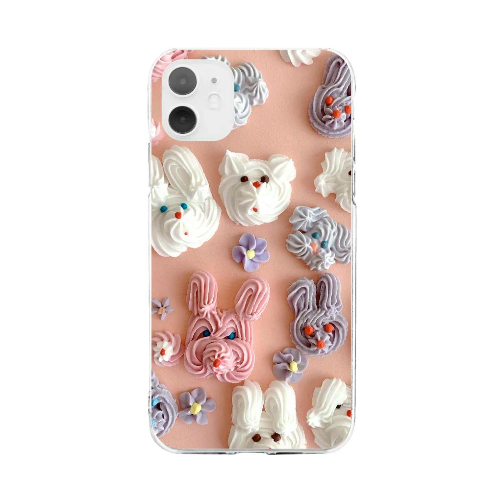 A plastic phone case showing the "シュガーアニマル" sugar-animal whipped-cream bunny pattern on a pink background.