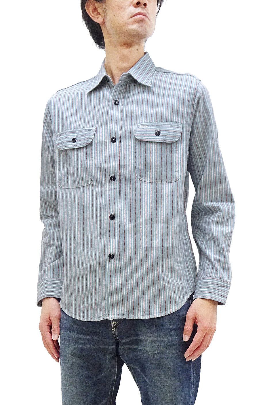 Male model wearing a long-sleeve blue dobby stripe button-up work shirt.