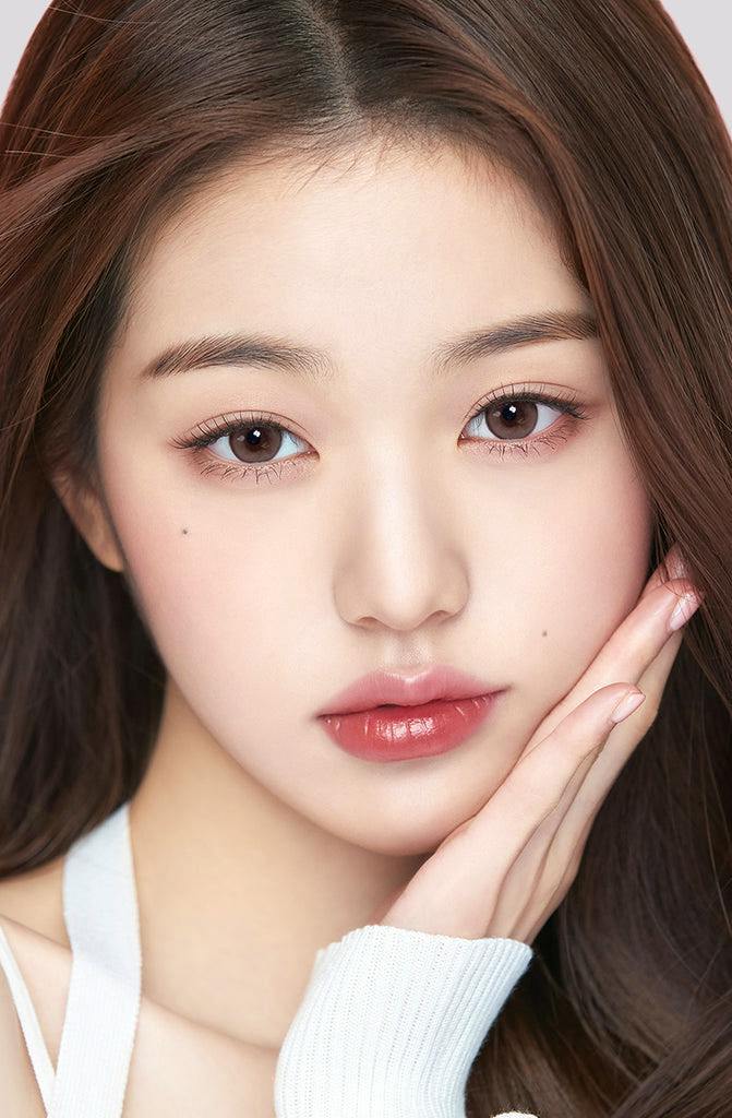 Close-up portrait of a model wearing the contact lenses, showing her face and eyes.