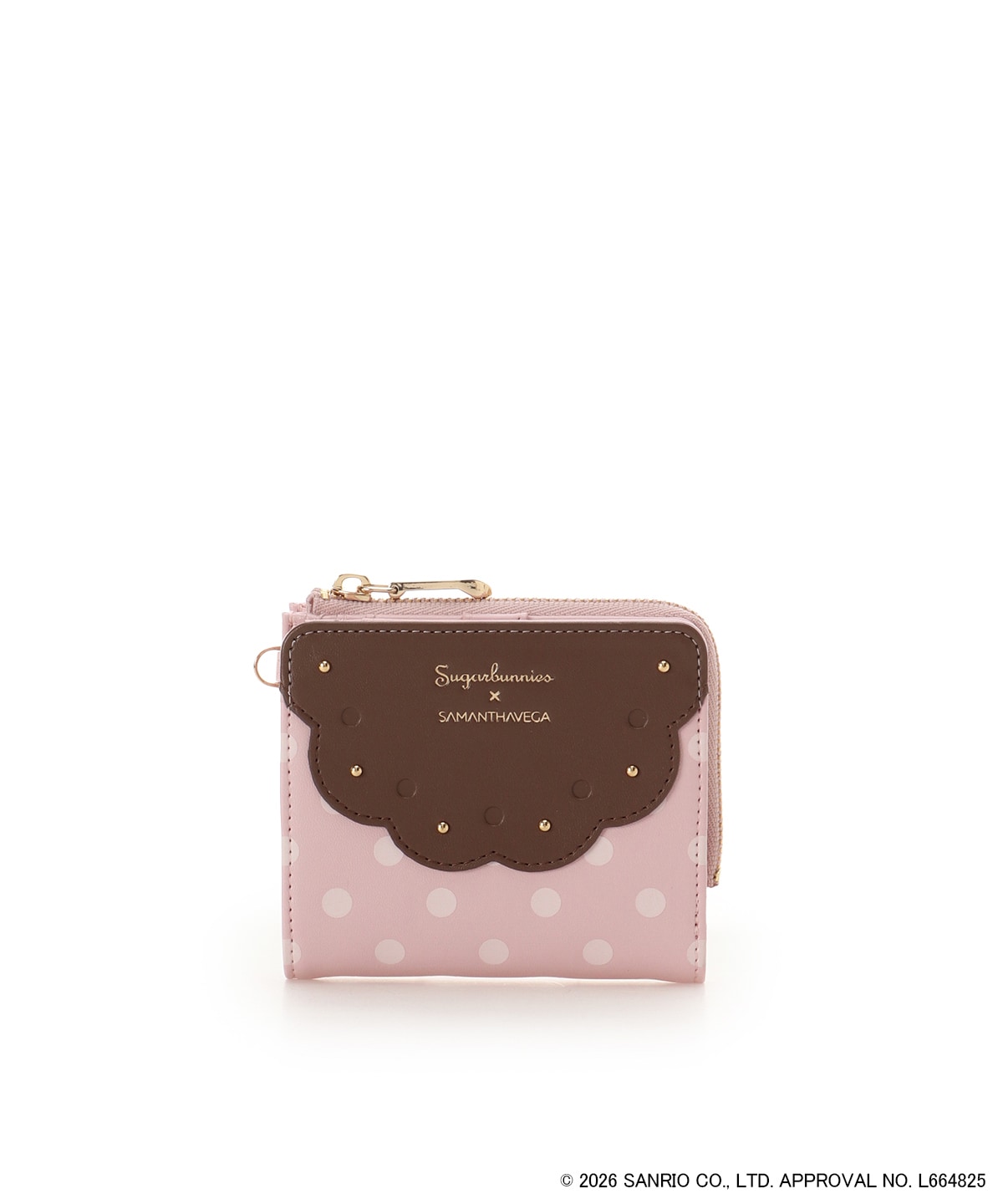 Front view of the 'シュガーバニーズ' folding wallet: pink polka-dot cow leather with a brown scalloped flap, gold studs, and a zipper.