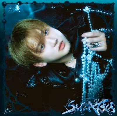 CD cover art showing a close-up portrait of a person holding a string of pearls against a dark background.