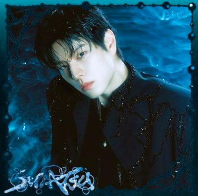 Cover art for SUIATSU (Seungmin edition) showing a portrait of Seungmin against a blue watery background with the stylized title at the bottom.