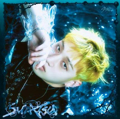 CD cover art showing a close-up portrait of a person with yellow hair against a blue watery background.