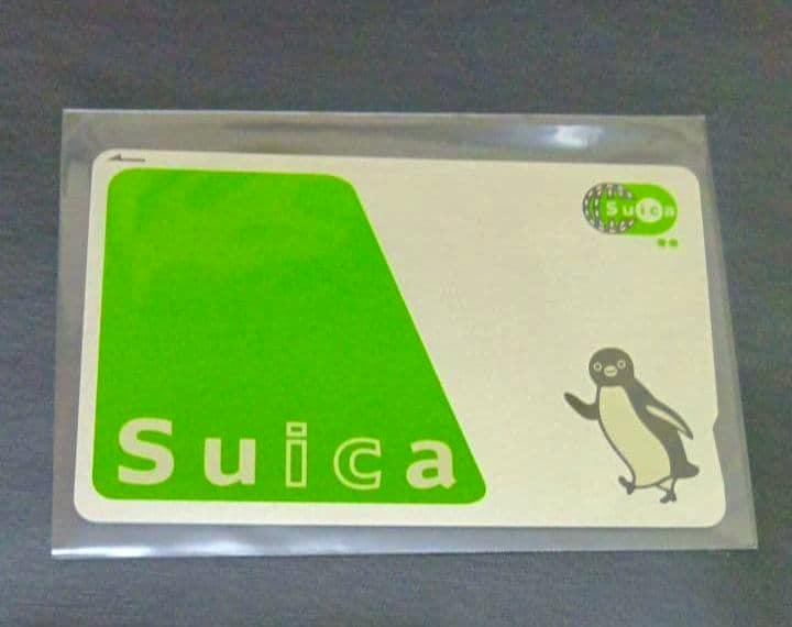 A Suica card showing the green Suica logo and penguin mascot.