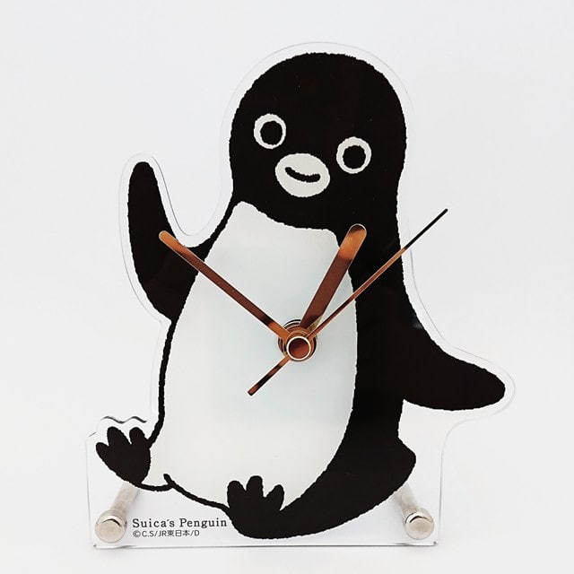 Front view of the penguin-shaped acrylic wall clock showing the printed Suica penguin design and attached clock hands.