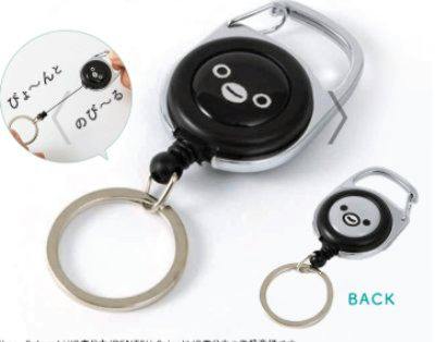 Two views of a black Suica penguin metal reel keychain with a split ring and carabiner clip.