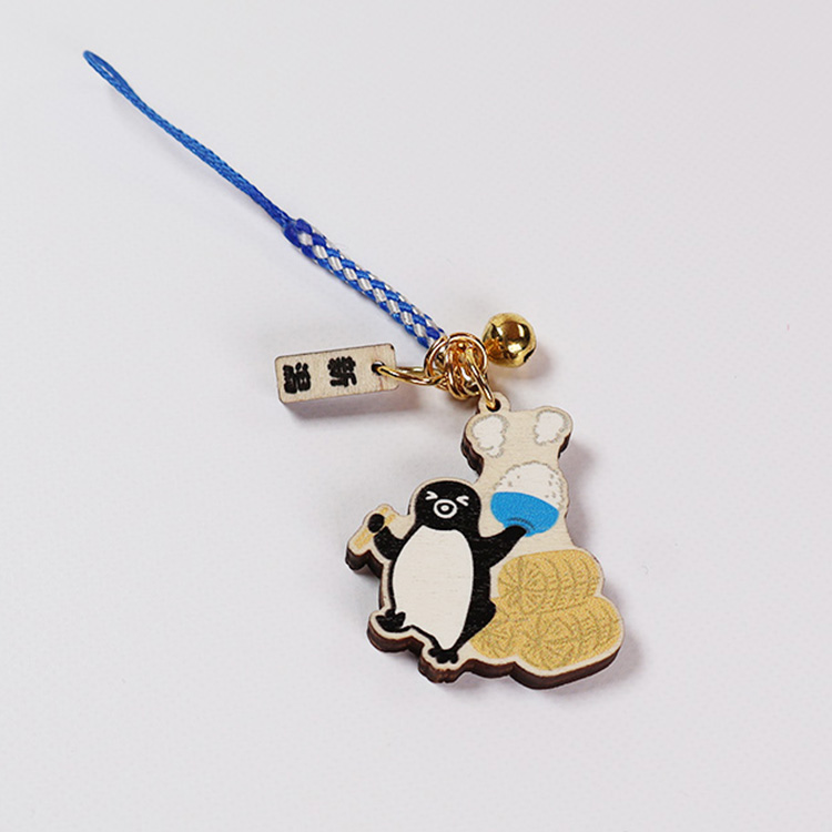 Wooden Suica penguin keychain strap with a blue cord, small bell, and a rectangular tag.