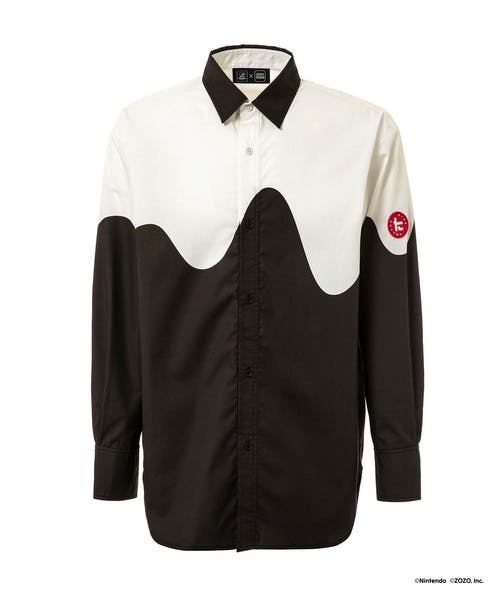 Front view of a long-sleeve button-up shirt with a white upper area and black lower area separated by a wavy line and a small red circular patch on the sleeve.