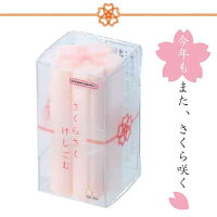 Clear plastic case holding pink sakura-shaped erasers with decorative packaging and Japanese text.