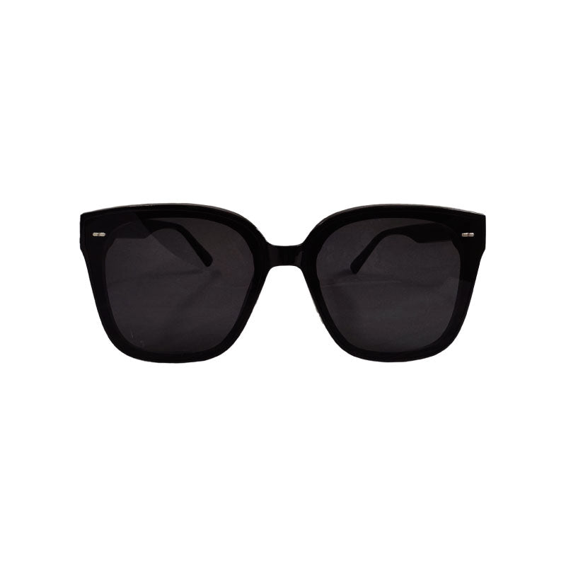 Front view of black sunglasses with dark lenses on a white background.