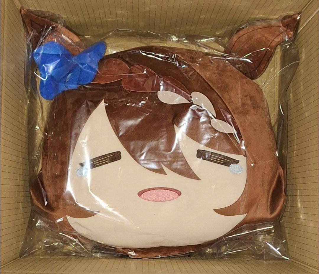 Large face plush (Super Creek) shown in clear plastic packaging inside a cardboard box.