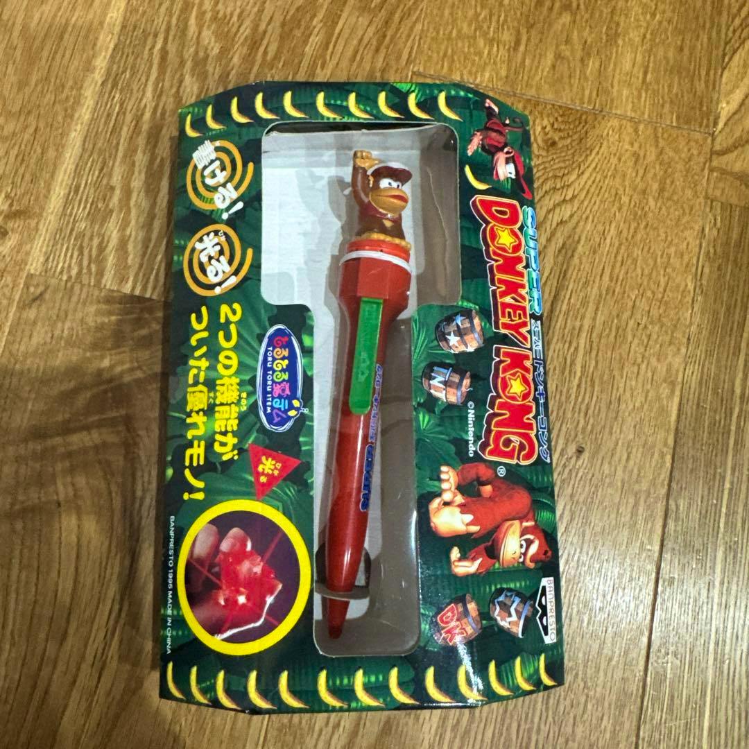 Packaged Super Donkey Kong novelty ballpoint pen with a Donkey Kong figure topper visible through blister packaging.