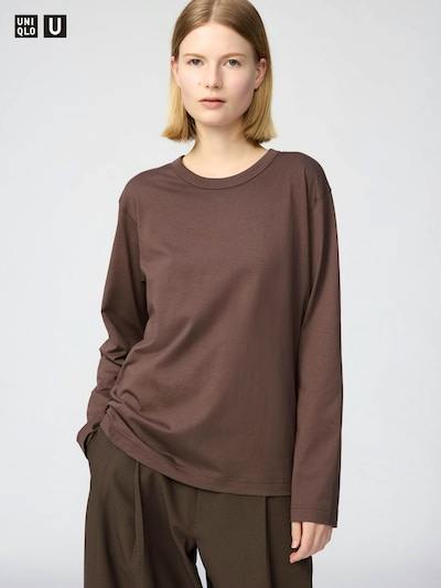 A model wearing a brown Supima cotton long-sleeve T-shirt shown from the waist up.