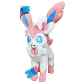 A Sylveon (ニンフィア) plush toy in white, pink, and blue with ribbon-like feelers.
