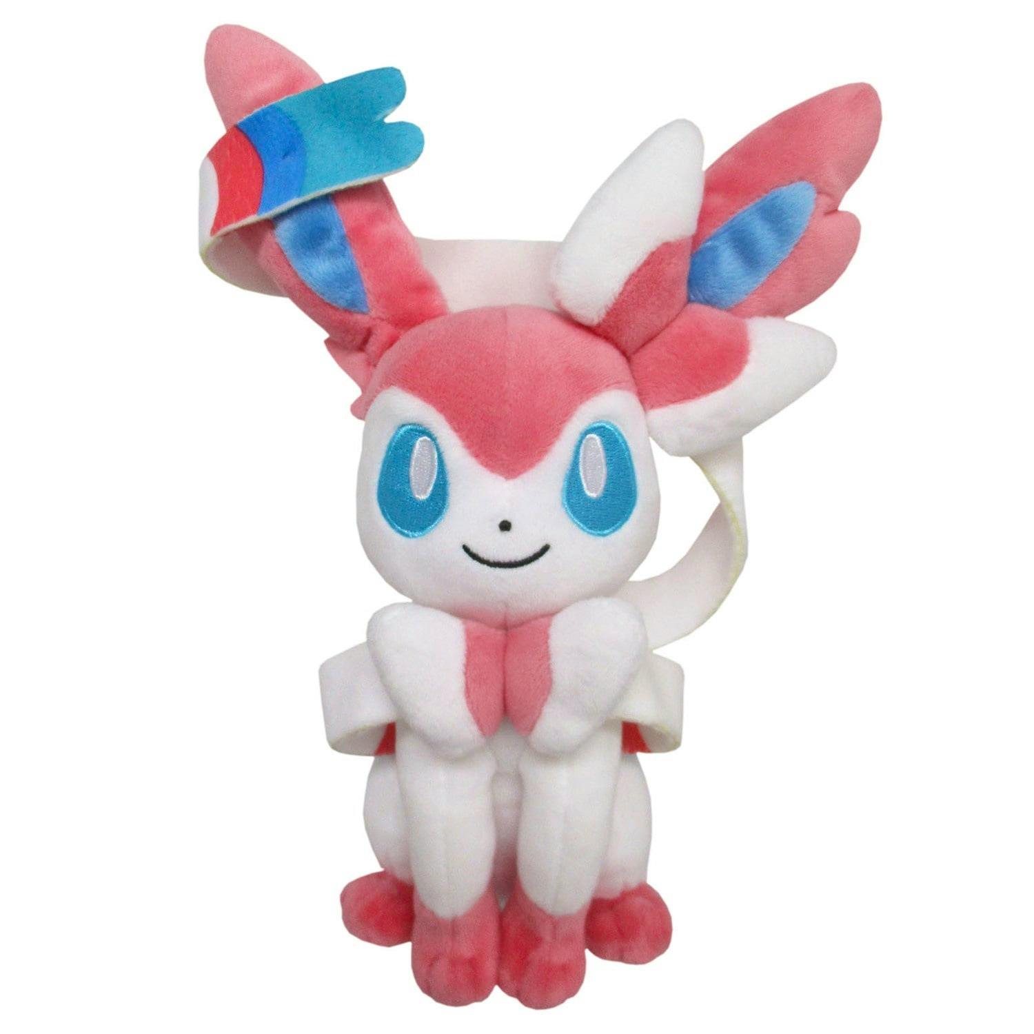 A front view of the ぬいぐるみ(S) ニンフィア plush showing its pink-and-white body, blue eyes, and ribbon-like ears.