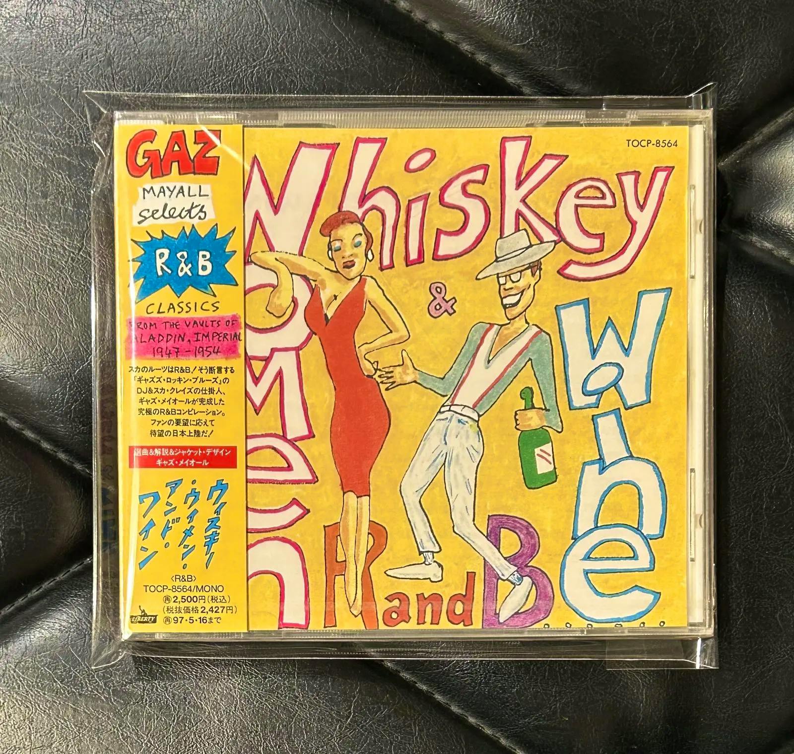 Front of a sealed CD showing illustrated cover art with the title 'Whiskey' and a Japanese obi strip.