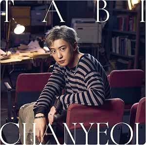 Cover art for the CD showing a seated person wearing a striped sweater in a room with bookshelves and lamps.