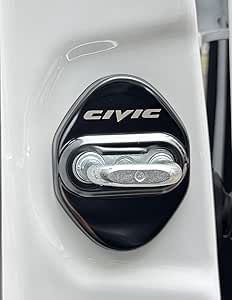 Close-up of a black door striker cover labeled "CIVIC" installed around the stainless steel door lock striker on a white car door frame.