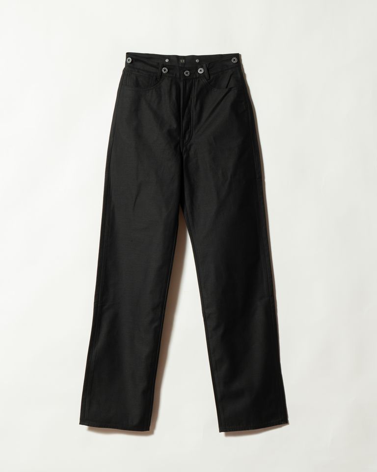 Front view of black buckle-backed men's cotton trousers laid flat on a white background.
