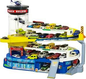 Front view of the Takara Tomy Tomica multi-level toy building playset with many small Tomica cars on its ramps and levels.