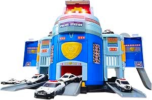 Blue plastic Takara Tomy police station toy playset with open doors and several small police cars in front.