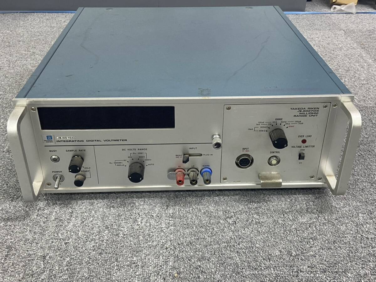 Front view of the TAKEDARIKEN TR6027DS milliohm range unit and TR6515D integrating digital voltmeter showing front panel, knobs, and connector terminals.