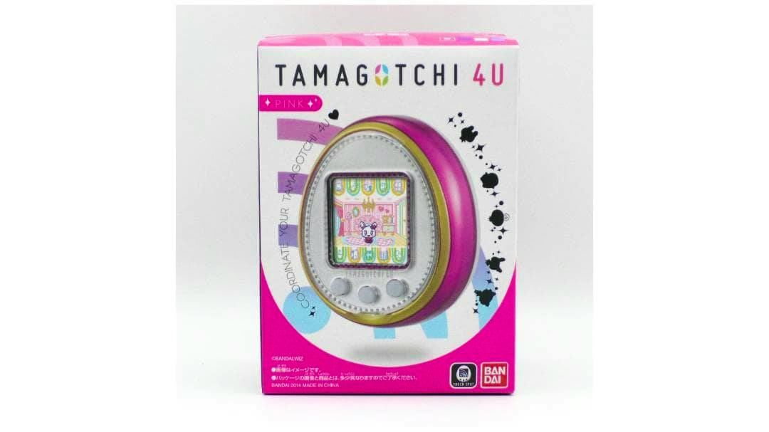 Front view of the boxed pink TAMAGOTCHI 4U handheld game packaging showing the device image and branding.