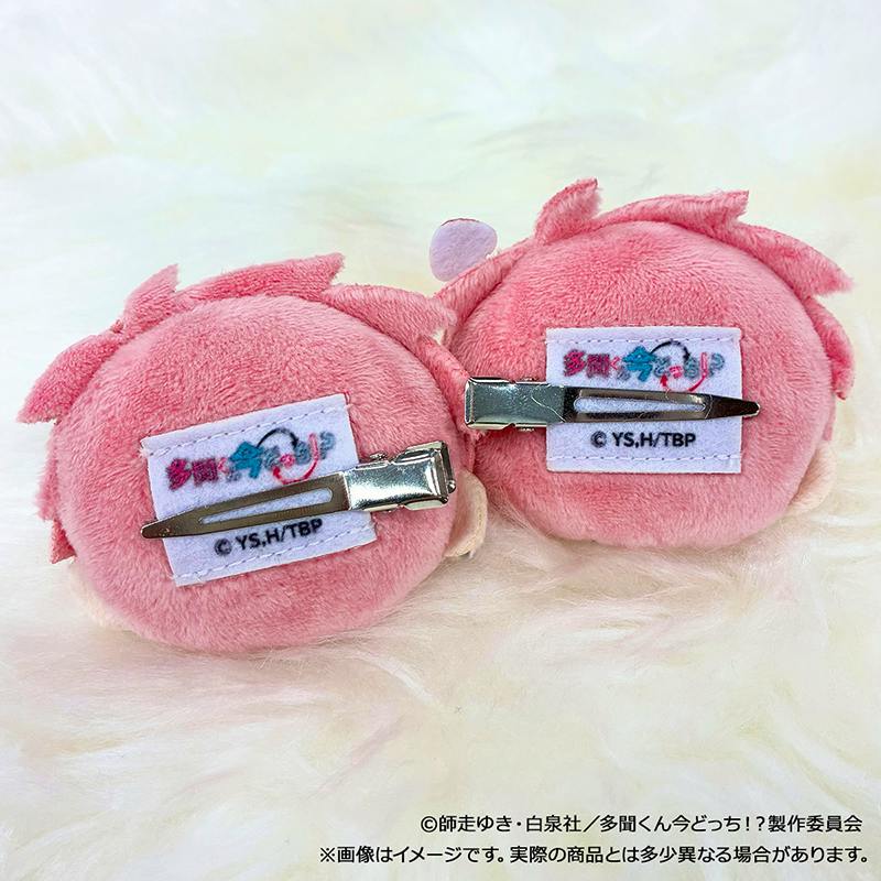 Two pink plush hair clip accessories shown from the back with metal alligator-style clips attached.