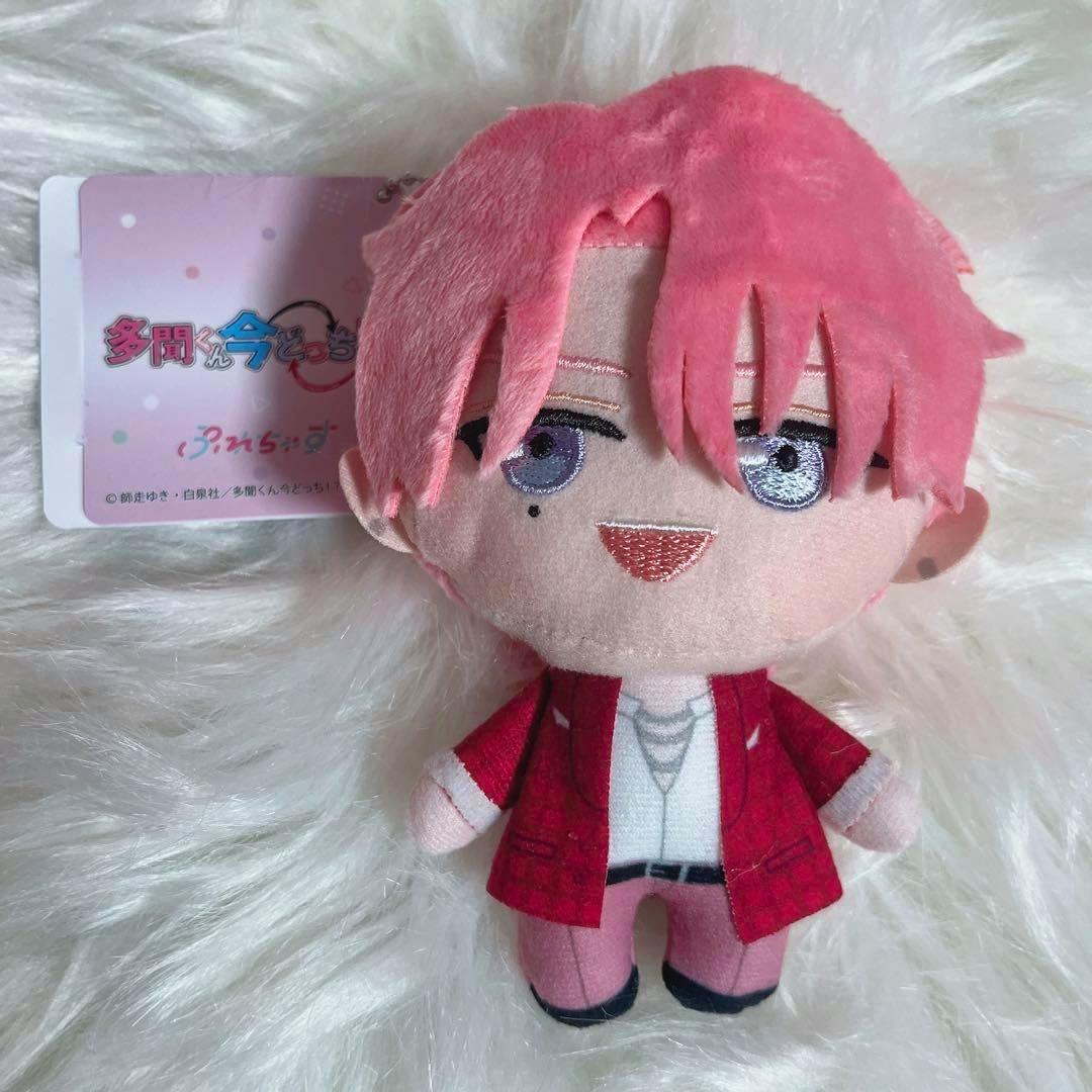 Front view of the 福原多聞 F/ACE plush with pink hair and a red jacket, tag visible on a white fur background.