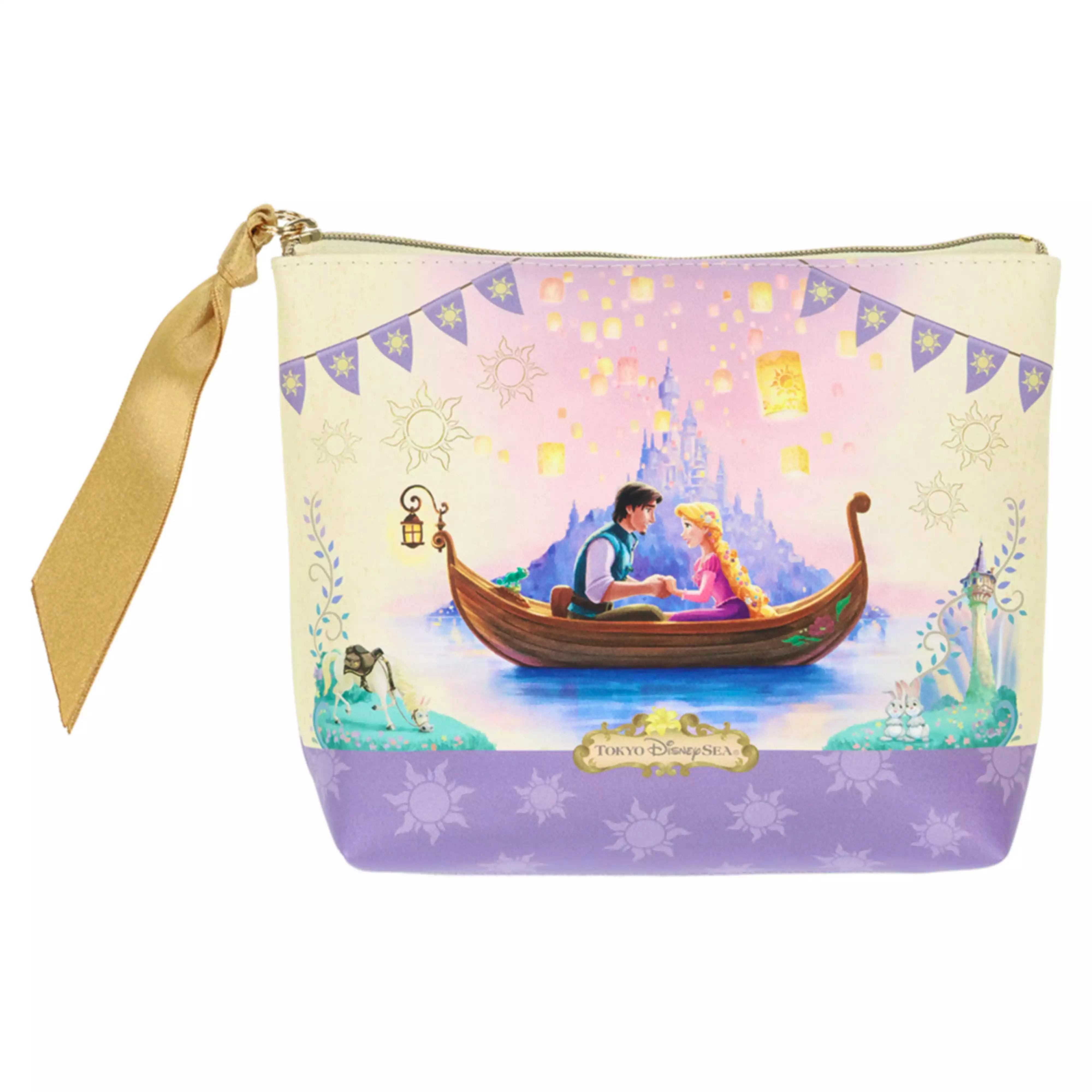 Front view of a polyester pouch showing a printed Rapunzel scene of Rapunzel and a man in a boat, a purple lower panel, and a gold ribbon wrist strap.