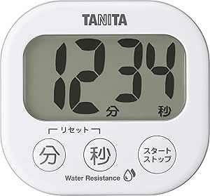 Front view of a white Tanita Dekamie kitchen timer showing a large digital display and three round control buttons.