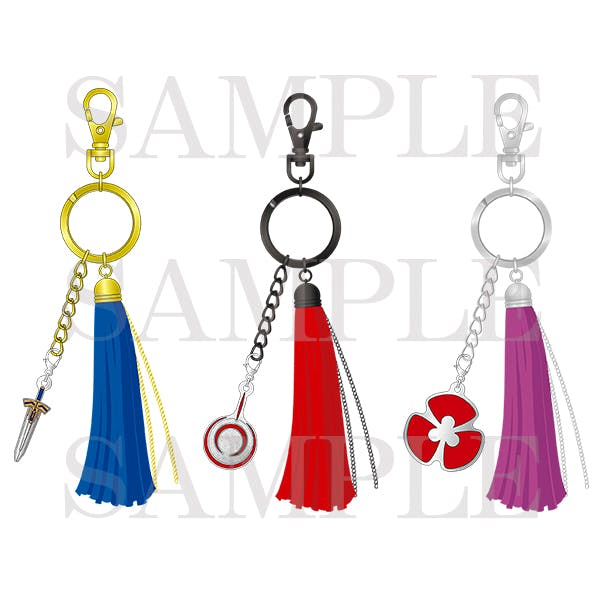 Illustration of three tassel charms (blue, red, purple) each with a metal ring, clasp, and a small dangling charm.