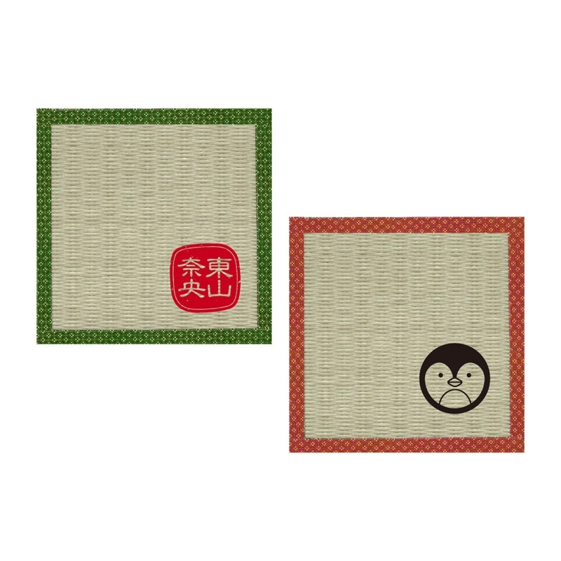 Two square tatami-style coasters with woven texture, one with a green border and red seal, the other with a red border and a small penguin-like logo.
