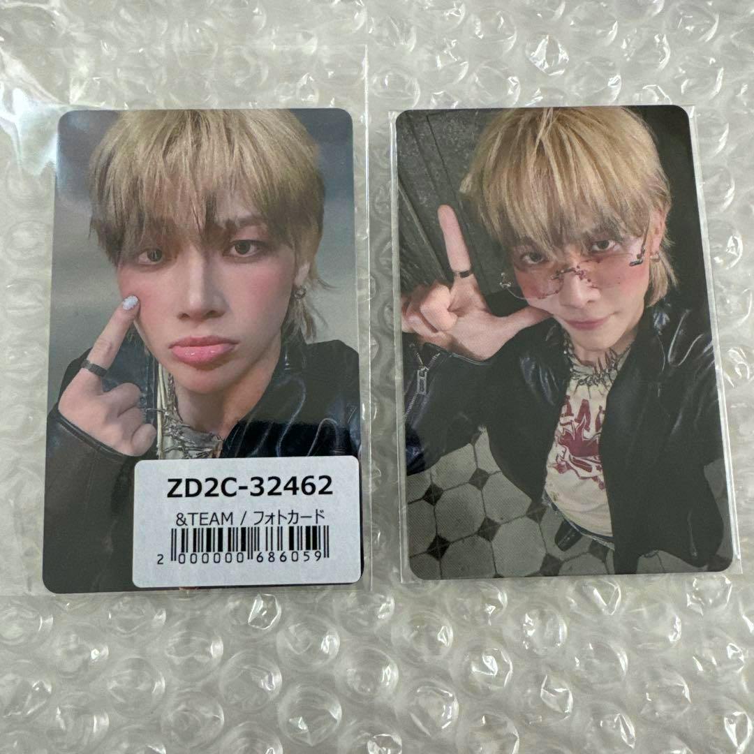 Two photocard fronts lying on bubble wrap, left card has a white sticker labeled ZD2C-32462.
