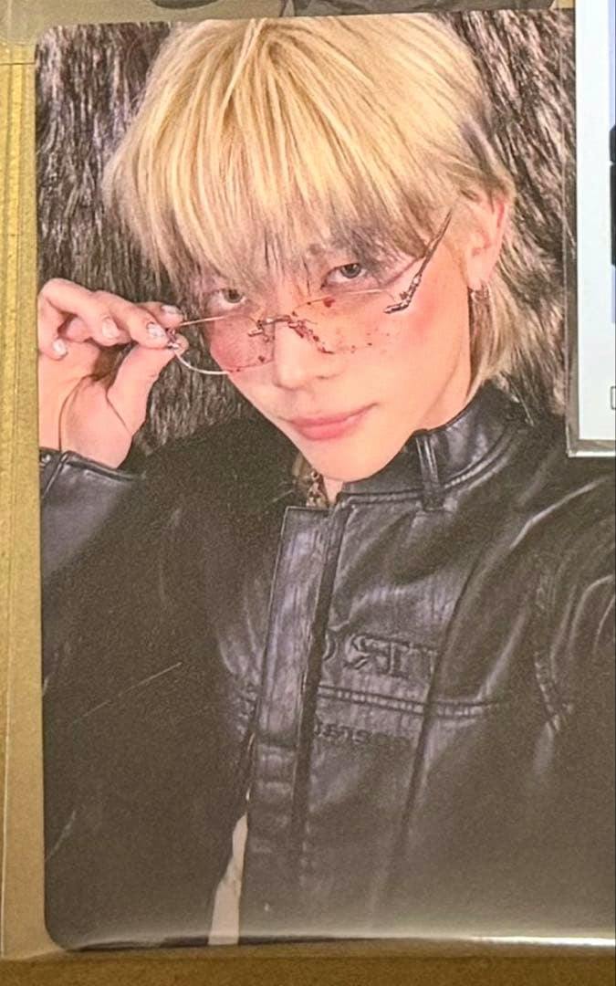 Photocard (Back to Life) showing a person wearing tinted glasses and a black leather jacket.