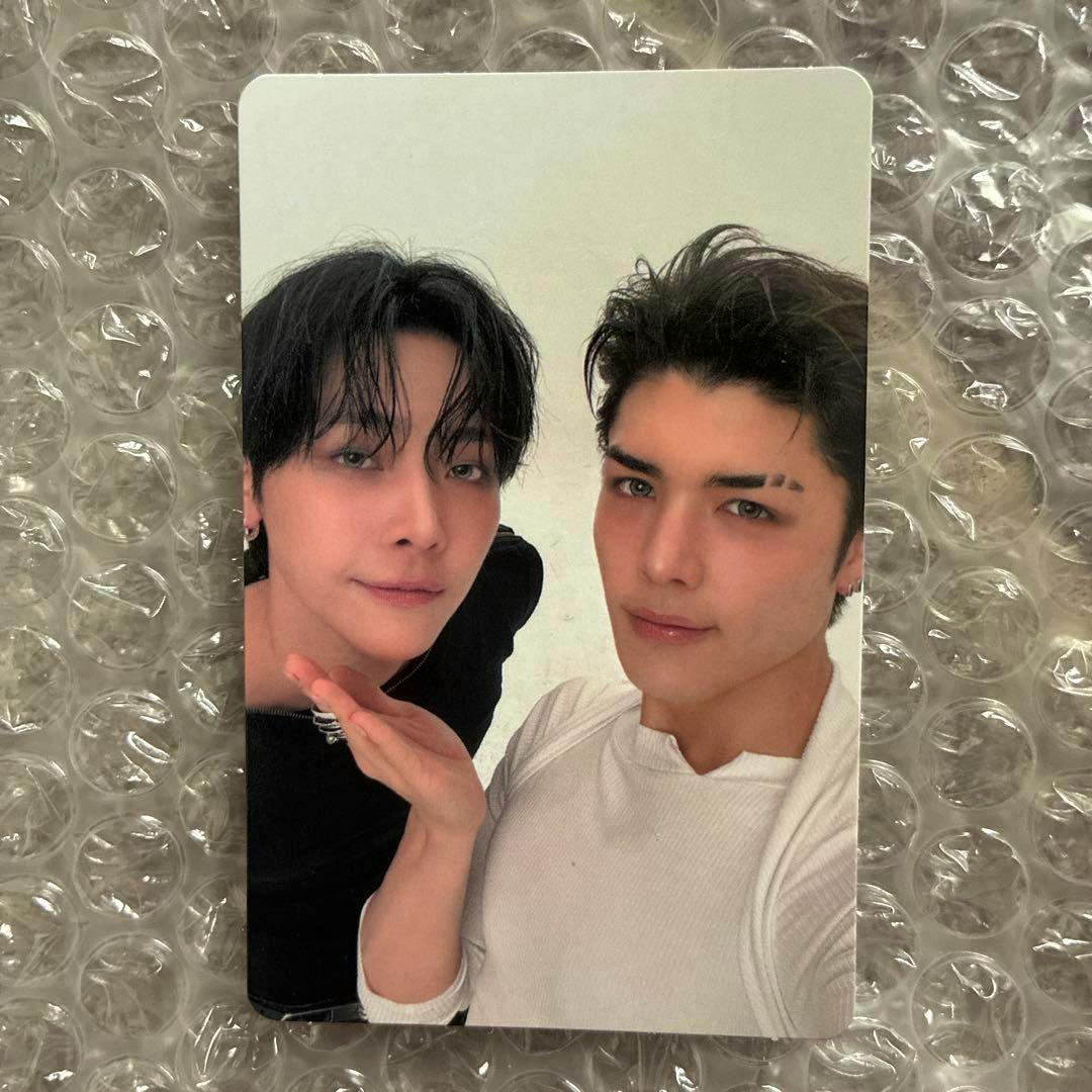 &TEAM NICHOLAS MAKI photocard depicting two people posing together, placed on bubble wrap.
