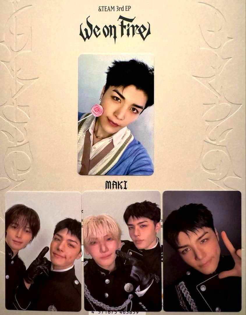 A photo of a sheet displaying four &TEAM “We on Fire” photocards featuring MAKI, with a portrait card at the top and three cards below.