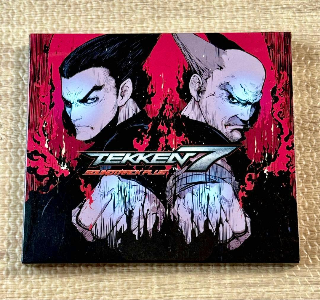 Front cover of the Tekken 7 soundtrack PLUS CD featuring illustrated character artwork and the Tekken 7 logo.