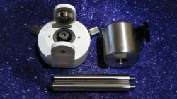 Metal base components and three support rods for a Polarie U PCBU-EQ2 head/base set on a blue background.