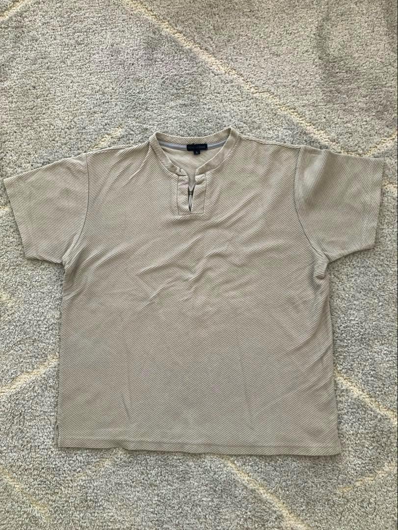 Flat-lay photo of the front of a TETE HOMME men's short-sleeve shirt with a small front zipper.
