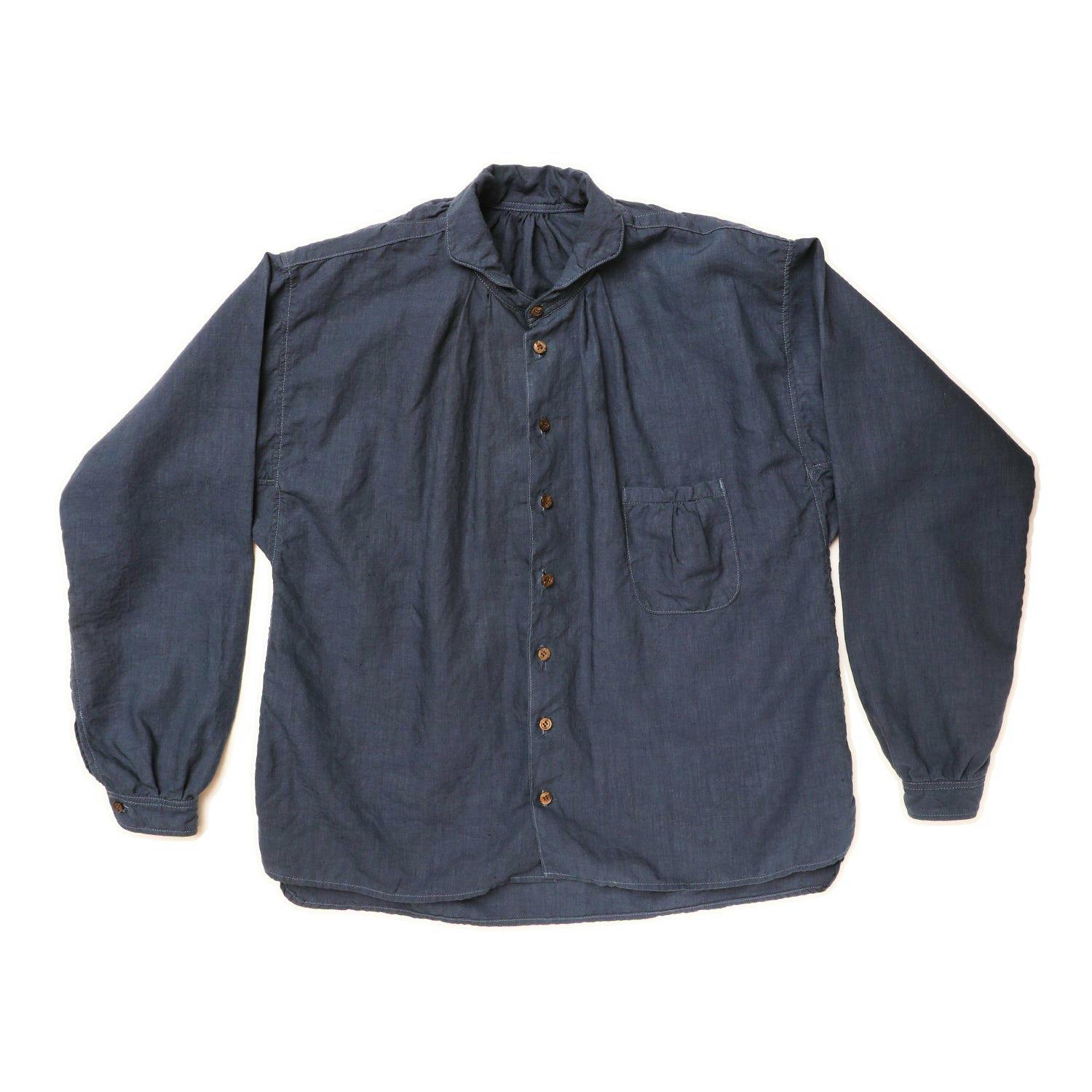 Flat-lay of The 2 Monkeys Linen Cambrai men's shirt showing the front with button closure, long sleeves, and a chest pocket.