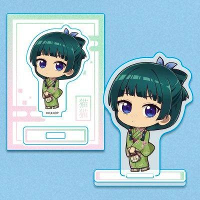 A mini acrylic stand of the character 猫猫 in chibi style with its display base and illustrated backing card.