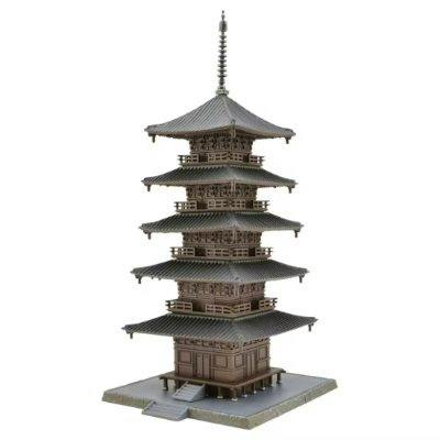 Plastic figure of a multi-tiered Japanese pagoda temple on a square base against a white background.